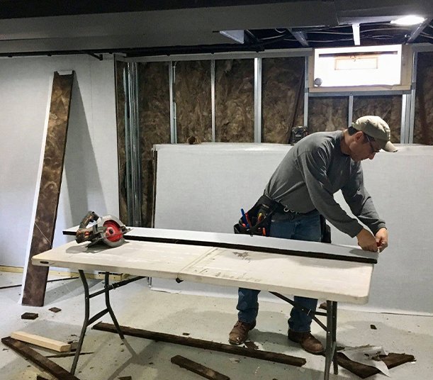 Contractor discussing basement remodeling plans